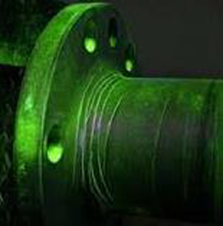 An example of Magnetic Particle Inspection in progress, showing rings around the tool under florescent lighting.